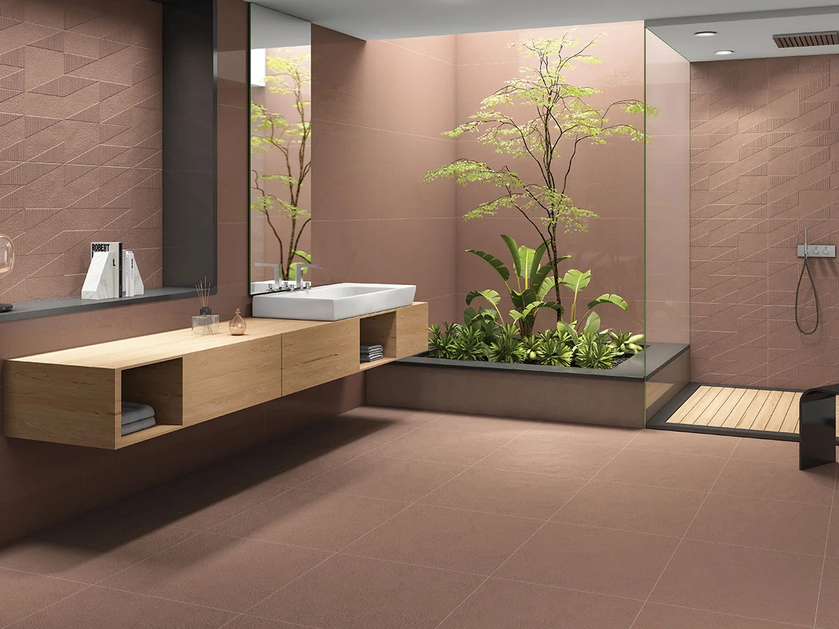 A tiled bathroom with a stone-effect wall and floor