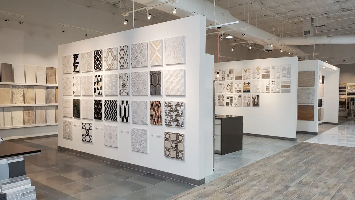Tile display panels along the wall of the Jaipur Tiles showroom