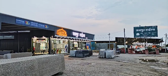 Granite and marble slabs in the open yard beside the showroom during the day